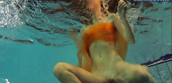  Yellow and Red clothed teen underwater